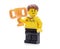 Lego minifigure in brand uniform hods a golden cup