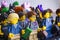 Lego minifigures. Lego businesswoman and businessmen standing in front row.