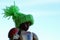 LEGO Star Wars action figure of Finn with armor and handmade knitted green wooly winter cap with fluffy pom pom on top.