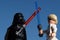 Lego Star Wars figures of Luke Skywalker and Darth Vader fighting with lightsabers