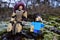 LEGO Star Wars Rey Skywalker figure with winter dreadlock looking cap sitting on frozen moss with Steve figure from Minecraft.