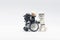Lego storm trooper pushing wheelchair with injured darth vader