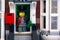 Lego thief minifigure standing on doorstep of robbed house