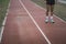 Legs of the athlete standing on a track field