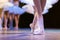 Legs of ballerinas dancing in ballet