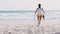 Legs, beach and woman with snorkel by the sea running and ocean ready for free diving. Morning, sports and run of a
