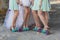 Legs of the bride and bridesmaids, and flower bouquets