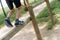 Legs of child climbs on a calisthenics