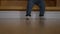 Legs of child in jeans standing up from stairs in living room. Unrecognizable baby trying to walk at home indoors