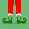 Legs Christmas Elf in green shoes with bells, in striped stockings and in short red breeches