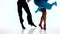 Legs couple ballroom dancers perform rumba, white background. Slow motion