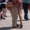 Legs of couples of tango dancers on main place with o