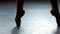 Legs of dancing ballerina close up.