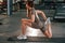 Legs exercises. Beautiful woman with sport body type is in the gym