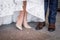 Legs and feet of married couple in stylish shoes