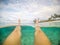 Legs and feet POV - split point of view of woman floating in clear sea at a beach at Matautu, Lefaga, Upolu Island, Samoa, South