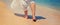 legs of a girl on the seashore. Selective focus