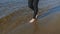 Legs girls walking on beach