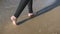 Legs girls walking on beach
