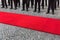 Legs of guard of honor and red carpet