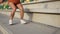 Legs jump close up. Fitness woman jumping outdoor in urban environment. Sport