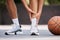 Legs, pain and sport injury with basketball and athlete on basketball court outdoor with emergency and fitness