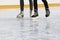 Legs people together skating on the ice rink