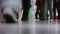 Legs of people walking in the mall. Selective focus.