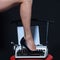 legs. retro typewriter. modern fashion. fetish wear shoes on leg of woman. seducing you. love education. epilation