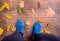 Legs of runner. Blue sports shoes. Colorful autumn leaves.