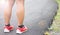 Legs and Running Shoe Closeup Of Man Jogging Outdoors On Public Park