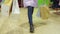 Legs shopper girl with shopping bag walking on clothes store down view. Female feets with shopping bag in fashion