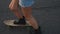 Legs of skateboarder riding skateboard