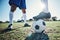 Legs, soccer and ball with players ready for kickoff on a sports field during a competitive game closeup. Football
