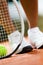 Legs of sportswoman near the tennis racket