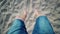 Legs on the Swing, Pov. Man`s Feet as He Sits on a Moving Swing at the Beach.