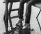 Legs of teenager sitting on the wooden dock