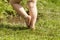 Legs of a toddler with diaper-Messy child feets on the grass