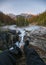 Legs traveler sit stretching on Sunwapta Falls in Icefields Parway at Jasper national park