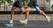 legs two male runners running city marathon race