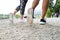 Legs of unrecognizable running couple in sports shoes