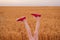 Legs upwards on wheat field background. Creative approach to solving problems