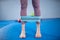 Legs woman barefoot doing pilates exercise with elastic fabric resistance band. Resistance Bands for butt and Legs, Exercise bands