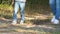 Legs of a woman and a child close-up. Mother and little boy travelers are on a sandy road in the woods. Tourism