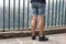 Legs of woman in short pants at viewpoint Madeira island