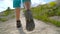 Legs of woman in tourist boots close-up. Hiking