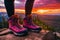 The legs of a woman traveler stands in pink hiking shoe for cross-country travel