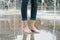 Legs of young girl in wet jeans with summer city fountain