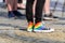 legs of young man in a sneakers with rainbow symbol of LGBT