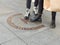 Legs of young people standing on km 0 sign, starting point of Madrid, Spain. Sign in Spanish language means: